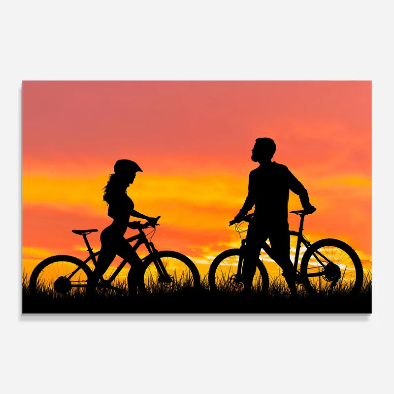 Geprüft Glasbild Orange Sunset Cyclists